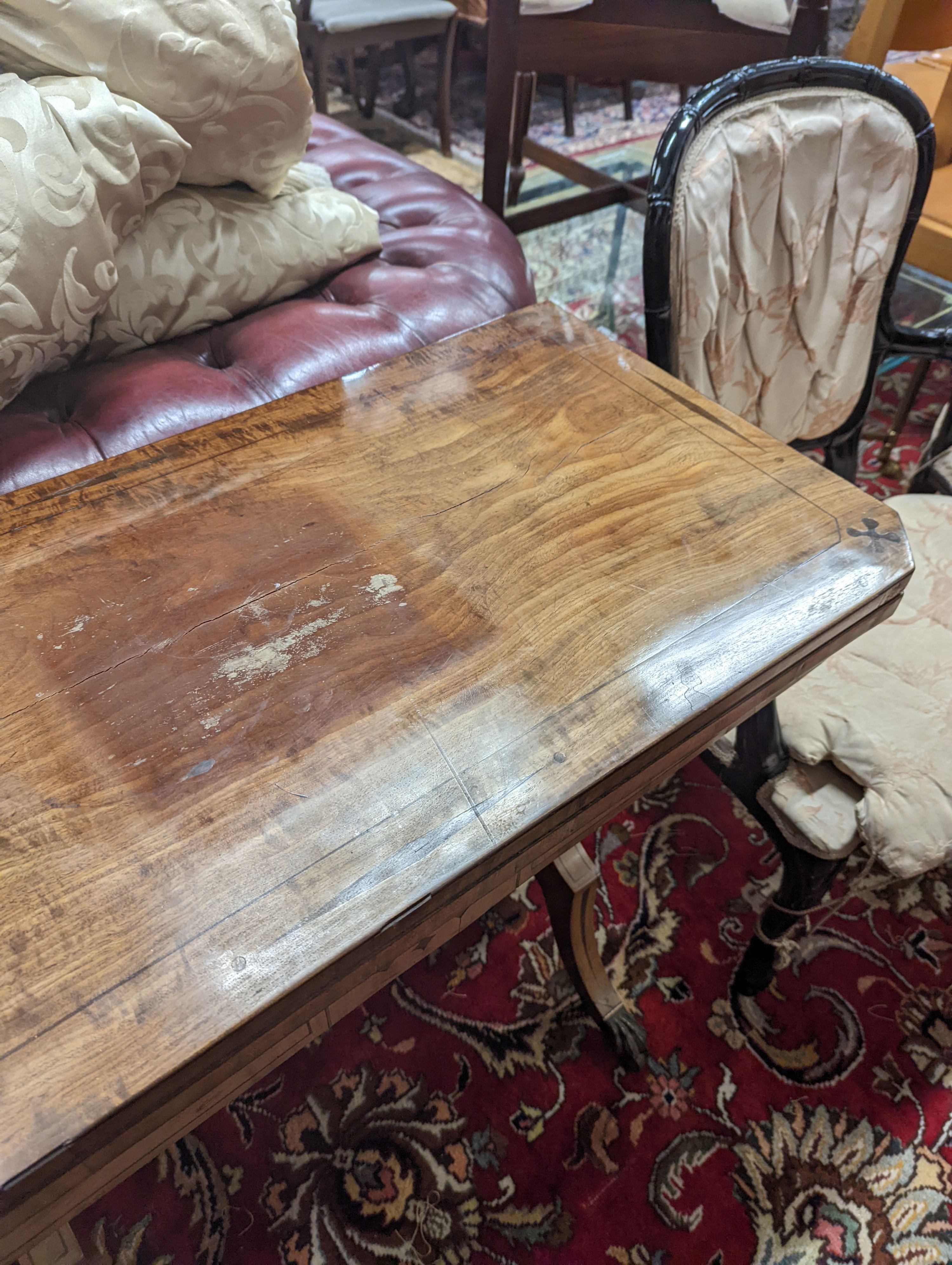 A Regency rectangular inlaid mahogany folding card table, width 91cm, depth 44cm, height 75cm